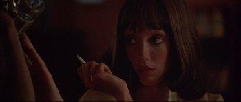Movie still from “3 Women” (1977), directed by Robert Altman – A woman is holding a cigarette in her hand; Close Up shot, Low angle