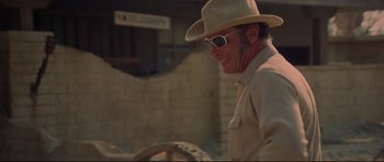 Movie still from “3 Women” (1977), directed by Robert Altman – A man wearing a cowboy hat and sun glasses; Medium shot, Over the shoulder angle