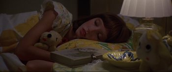 Movie still from “3 Women” (1977), directed by Robert Altman – A girl sleeping in bed with a teddy bear; Close Up shot, High angle