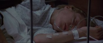 Movie still from “3 Women” (1977), directed by Robert Altman – A young child is sleeping in a hospital bed; Close Up shot, Overhead angle
