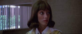 Movie still from “3 Women” (1977), directed by Robert Altman – A person wearing a yellow shirt; Close Up shot, Low angle