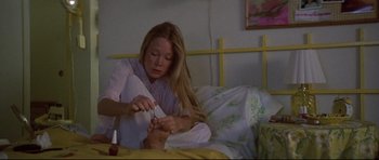 Movie still from “3 Women” (1977), directed by Robert Altman – A woman in a bed with a man in a bed; Close Up shot, High angle