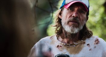 Movie still from “3 from Hell” (2019), directed by Rob Zombie – A person wearing a hat; Close Up shot, Over the shoulder angle