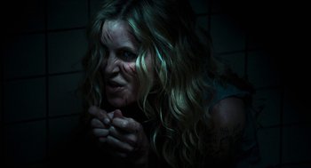 Movie still from “3 from Hell” (2019), directed by Rob Zombie – A person with long hair; Close Up shot, Over the shoulder angle