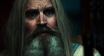 Movie still from “3 from Hell” (2019), directed by Rob Zombie – An old man with long hair and a long beard; Close Up shot, Low angle