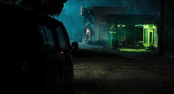 Movie still from “3 from Hell” (2019), directed by Rob Zombie – A car parked on the side of the road at night; Extreme Wide shot, Over the shoulder angle