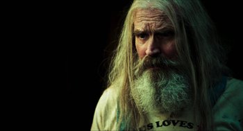 Movie still from “3 from Hell” (2019), directed by Rob Zombie – An old man with long white hair and a long beard; Close Up shot, Over the shoulder angle