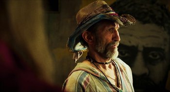 Movie still from “3 from Hell” (2019), directed by Rob Zombie – A man with a beard and a cowboy hat; Close Up shot, Over the shoulder angle