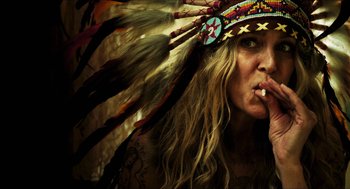 Movie still from “3 from Hell” (2019), directed by Rob Zombie – A person wearing a headdress; Close Up shot, Overhead angle