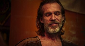 Movie still from “3 from Hell” (2019), directed by Rob Zombie – A man with long hair and a beard; Close Up shot, Over the shoulder angle