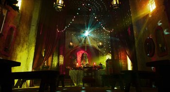 Movie still from “3 from Hell” (2019), directed by Rob Zombie – A room with lights and a statue in the center; Extreme Wide shot, Low angle