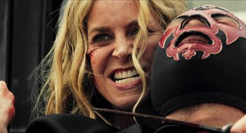 Movie still from “3 from Hell” (2019), directed by Rob Zombie – A person with a face paint on; Close Up shot, Over the shoulder angle