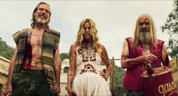 Movie still from “3 from Hell” (2019), directed by Rob Zombie – A group of people standing next to each other; Medium shot, Low angle
