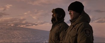Movie still from “30 Days of Night” (2007), directed by David Slade – Two men standing next to each other in the snow; Medium shot, Low angle