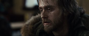 Movie still from “30 Days of Night” (2007), directed by David Slade – A person with a beard; Close Up shot, Over the shoulder angle