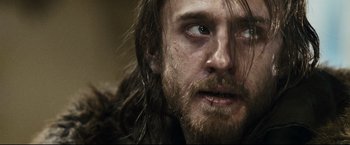 Movie still from “30 Days of Night” (2007), directed by David Slade – A person with long hair and a beard; Close Up shot, Over the shoulder angle