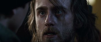 Movie still from “30 Days of Night” (2007), directed by David Slade – A man's face with wet hair; Close Up shot, Low angle