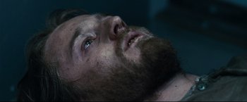 Movie still from “30 Days of Night” (2007), directed by David Slade – A person with a beard; Close Up shot, Overhead angle