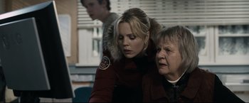 Movie still from “30 Days of Night” (2007), directed by David Slade – A woman and a woman in a red jacket; Close Up shot, Over the shoulder angle