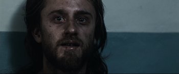 Movie still from “30 Days of Night” (2007), directed by David Slade – A person with long hair and a beard; Close Up shot, Low angle