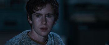 Movie still from “30 Days of Night” (2007), directed by David Slade – A person wearing a sweater; Close Up shot, Over the shoulder angle
