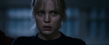 Movie still from “30 Days of Night” (2007), directed by David Slade – A person wearing a black shirt; Close Up shot, Over the shoulder angle