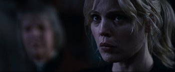Movie still from “30 Days of Night” (2007), directed by David Slade – A woman's face in the dark; Close Up shot, Over the shoulder angle
