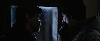 Movie still from “30 Days of Night” (2007), directed by David Slade – Two men are facing each other in the dark; Close Up shot, Over the shoulder angle
