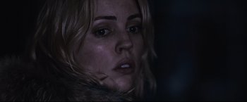 Movie still from “30 Days of Night” (2007), directed by David Slade – A woman's face in the dark; Close Up shot, Low angle