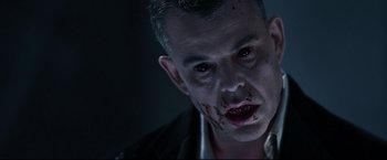 Movie still from “30 Days of Night” (2007), directed by David Slade – A person with blood on his face; Close Up shot, Overhead angle
