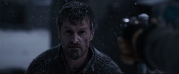 Movie still from “30 Days of Night” (2007), directed by David Slade – A person with a camera in the snow; Close Up shot, Over the shoulder angle