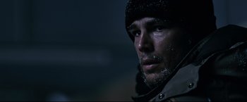 Movie still from “30 Days of Night” (2007), directed by David Slade – A person wearing a jacket and a hat; Close Up shot, Low angle