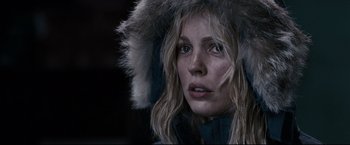 Movie still from “30 Days of Night” (2007), directed by David Slade – A person wearing a jacket and a fur hat; Close Up shot, Over the shoulder angle