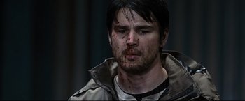 Movie still from “30 Days of Night” (2007), directed by David Slade – A person with blood on his face; Close Up shot, Over the shoulder angle