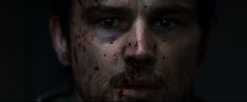 Movie still from “30 Days of Night” (2007), directed by David Slade – A person with blood all over his face; Extreme Close Up shot, Low angle