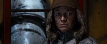Movie still from “30 Days of Night” (2007), directed by David Slade – A person wearing a jacket and a hat; Close Up shot, Low angle