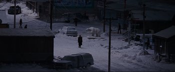 Movie still from “30 Days of Night” (2007), directed by David Slade – A man walking in the snow with a white polar bear; Extreme Wide shot, High angle