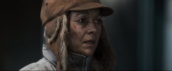 Movie still from “30 Days of Night” (2007), directed by David Slade – An old woman wearing a brown hat and jacket; Close Up shot, Over the shoulder angle