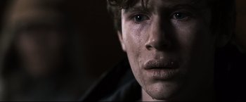 Movie still from “30 Days of Night” (2007), directed by David Slade – A man's face with tears coming out of his eyes; Close Up shot, Over the shoulder angle
