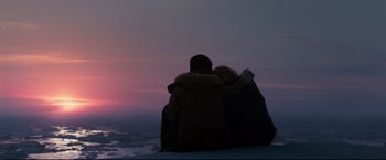 Movie still from “30 Days of Night” (2007), directed by David Slade – Two people sitting on top of a hill at sunset; Wide shot, Low angle