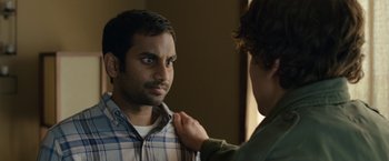 Movie still from “30 Minutes or Less” (2011), directed by Ruben Fleischer – Two people are looking at each other in the mirror; Close Up shot, Over the shoulder angle
