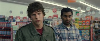 Movie still from “30 Minutes or Less” (2011), directed by Ruben Fleischer – Two men standing next to each other in a store; Close Up shot, Over the shoulder angle