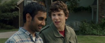 Movie still from “30 Minutes or Less” (2011), directed by Ruben Fleischer – Two men standing next to each other in front of a tree; Close Up shot, Over the shoulder angle