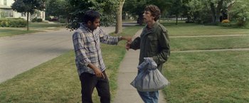 Movie still from “30 Minutes or Less” (2011), directed by Ruben Fleischer – Two men standing next to each other on a sidewalk; Medium shot, Over the shoulder angle