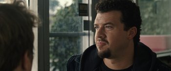 Movie still from “30 Minutes or Less” (2011), directed by Ruben Fleischer – A person looking out a window; Close Up shot, Over the shoulder angle