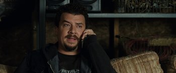 Movie still from “30 Minutes or Less” (2011), directed by Ruben Fleischer – A person talking on a cell phone; Close Up shot, High angle