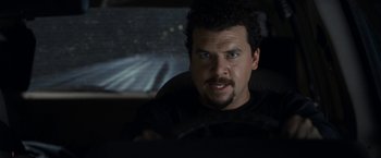 Movie still from “30 Minutes or Less” (2011), directed by Ruben Fleischer – A person driving a car; Close Up shot, Over the shoulder angle