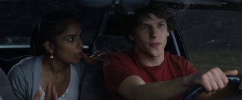 Movie still from “30 Minutes or Less” (2011), directed by Ruben Fleischer – A man and a woman sitting in the back of a car; Close Up shot, Over the shoulder angle