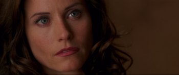 Movie still from “3000 Miles to Graceland” (2001), directed by Demian Lichtenstein – A woman's eyes and face; Close Up shot, High angle