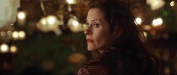 Movie still from “3000 Miles to Graceland” (2001), directed by Demian Lichtenstein – A person looking at the camera; Close Up shot, Over the shoulder angle